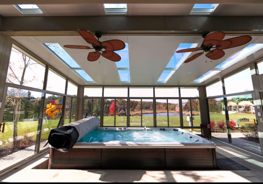 beautiful indoor swimming pool inside a sunroom in new jersey
