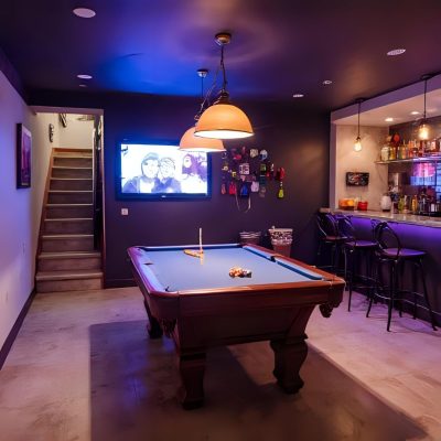 modern basement with led lights, pool table, and wet bar